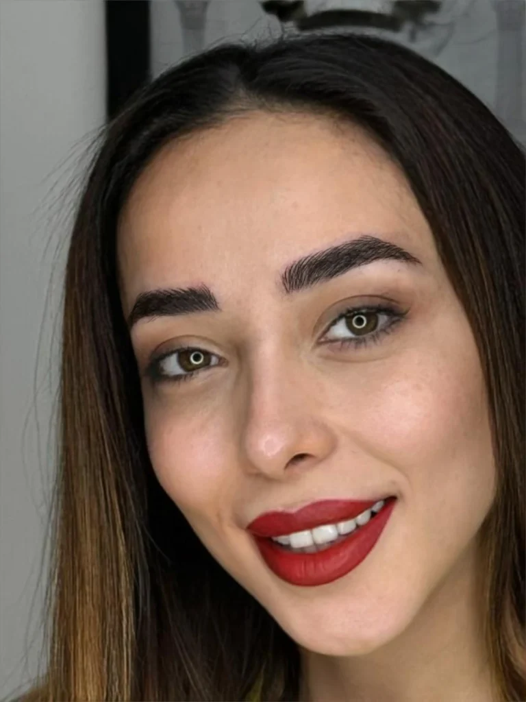 Full, natural-looking microbladed brows on a client with dark hair